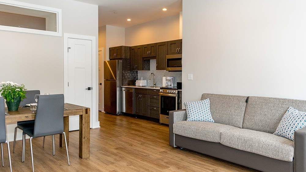 Couch, dining room leading into kitchen