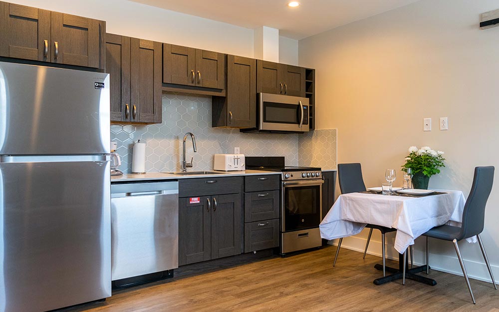 Kitchen with small table with 2 chairs