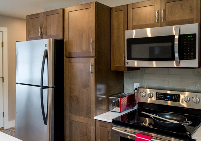 Kitchen with wood cabinets and stainless steel appliances