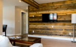 Wood paneled wall with mounted TV