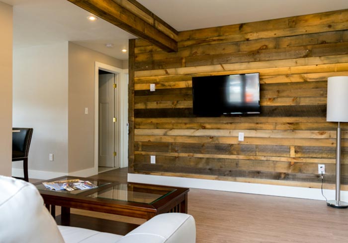 Wood paneled wall with mounted TV