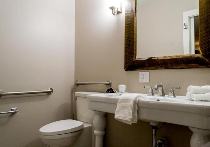 Bathroom with vanity and rustic wood mirror