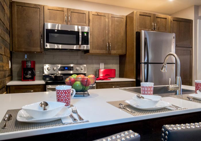 kitchen with place settings on eat-in counter