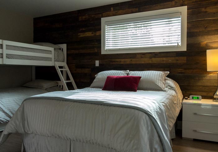 Bedroom with queen bed and bunk beds