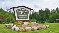 Lake Placid Inn Sign with landscaping