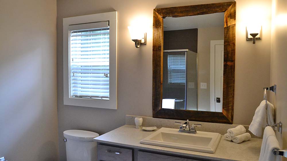 Bathroom with rustic mirror