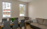 Dining area with small couch and chair in corner